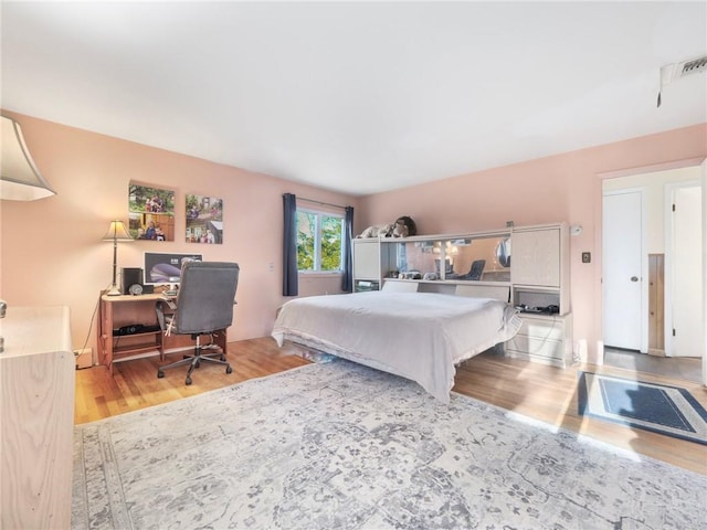 bedroom with light wood-type flooring