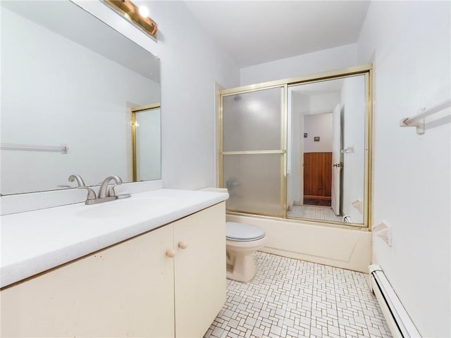 full bathroom featuring vanity, shower / bath combination with glass door, tile patterned flooring, toilet, and a baseboard radiator