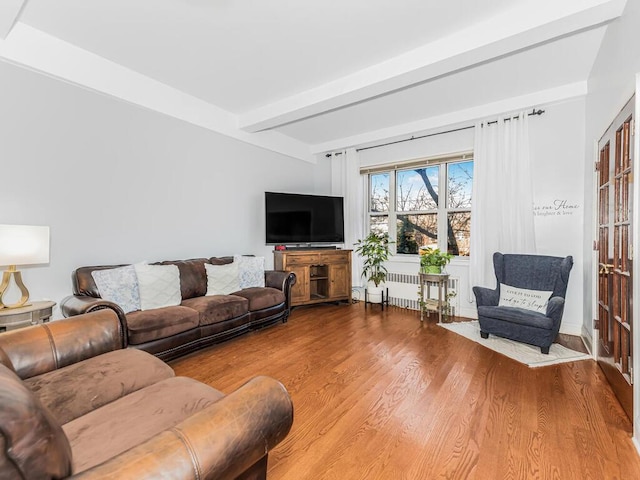 5601 Riverdale Ave Unit 1C, Bronx, NY 10471 - living area with radiator, beam ceiling, and wood finished floors