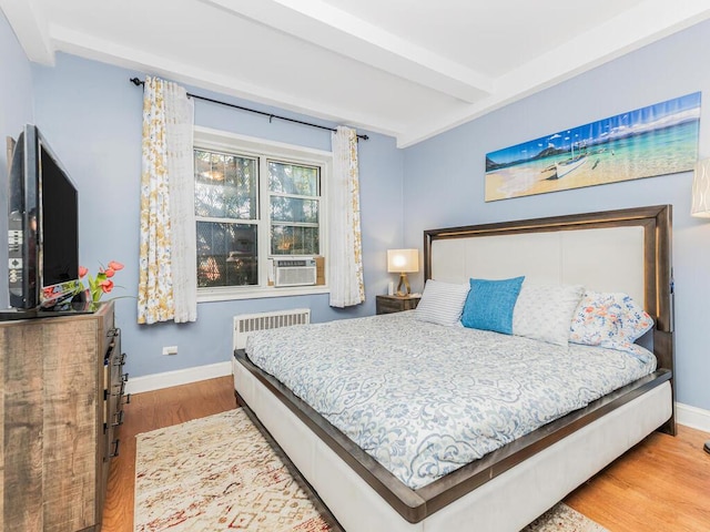 5601 Riverdale Ave Unit 1C, Bronx, NY 10471 - bedroom with beamed ceiling, wood finished floors, baseboards, and cooling unit