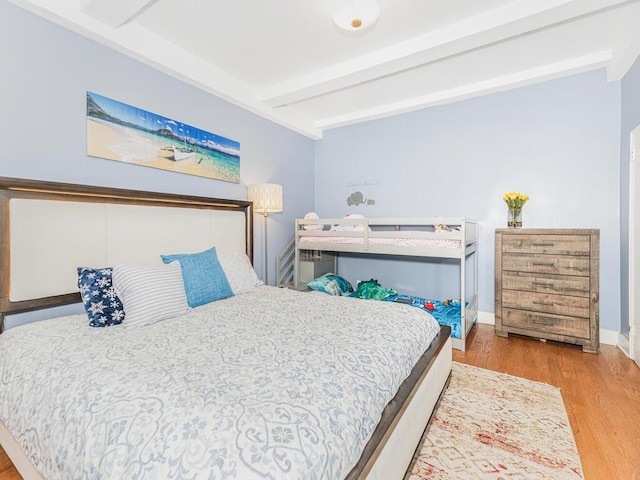 5601 Riverdale Ave Unit 1C, Bronx, NY 10471 - bedroom featuring beamed ceiling, wood finished floors, and baseboards