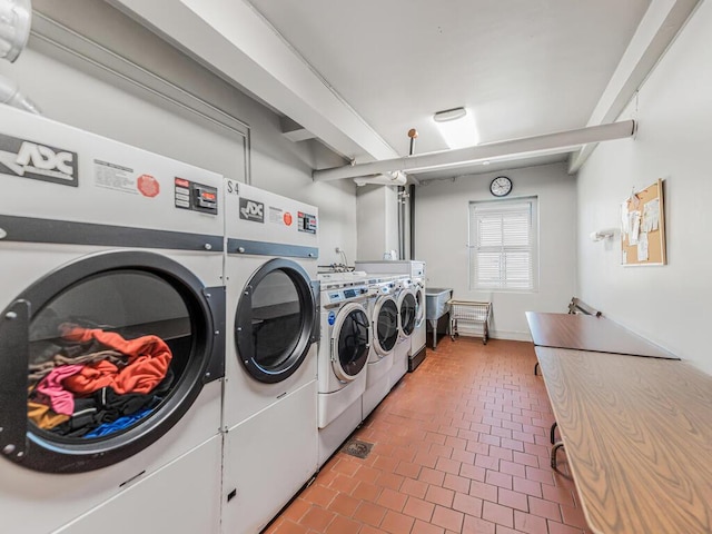 5601 Riverdale Ave Unit 1C, Bronx, NY 10471 - shared laundry room with washer and dryer and brick patterned floors