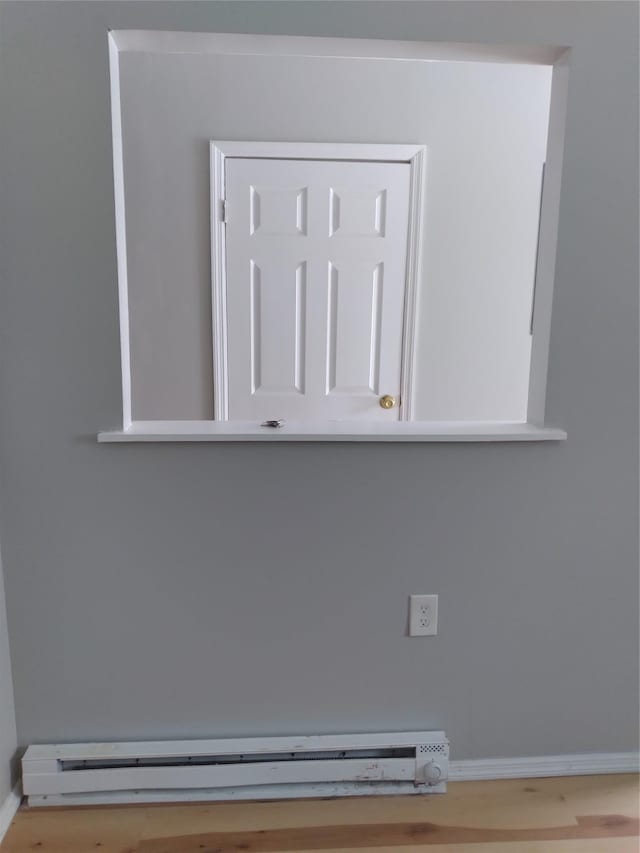 room details featuring a baseboard heating unit