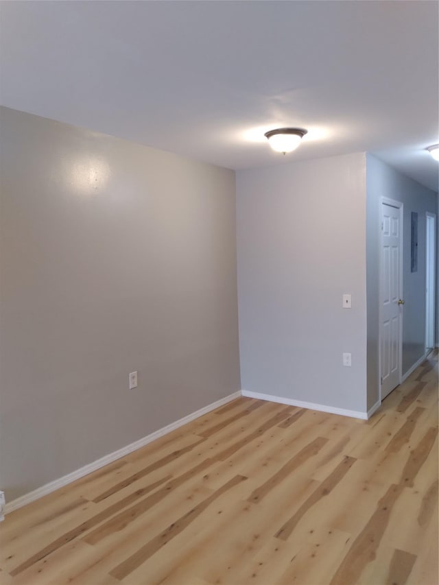 spare room featuring light hardwood / wood-style floors