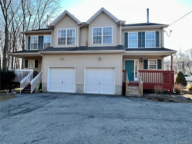 view of front of home with a porch and a garage