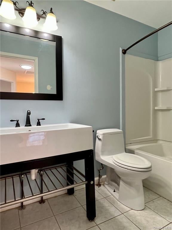 bathroom with toilet, shower / bath combination, and tile patterned floors