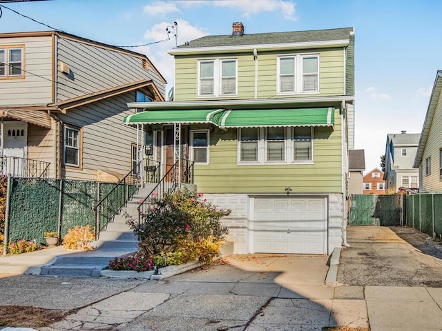 view of front of property with a garage