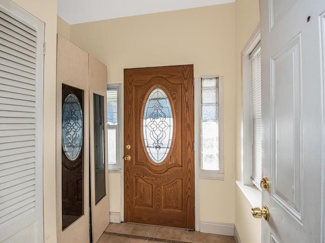 entryway with tile patterned floors