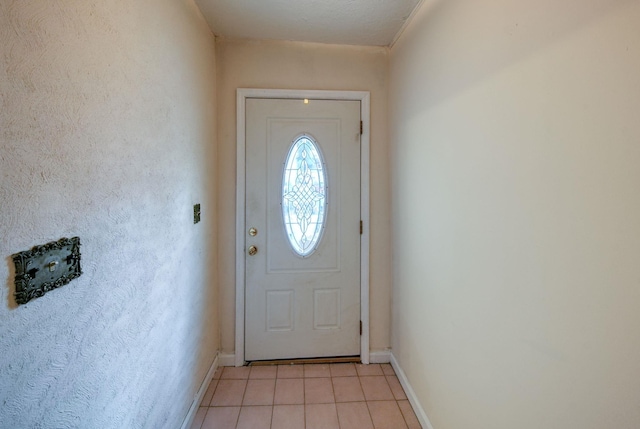 doorway with light tile patterned floors