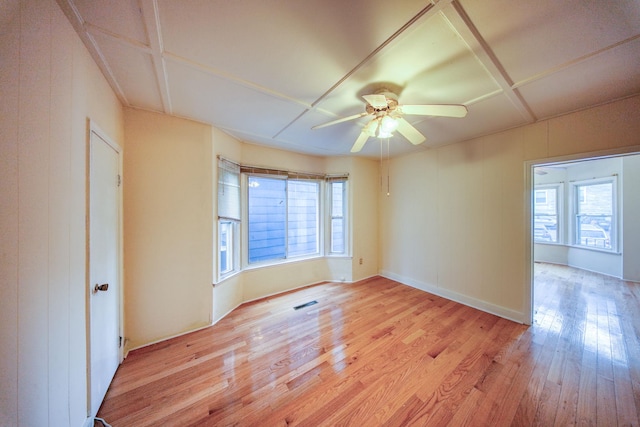 spare room with ceiling fan and light hardwood / wood-style floors