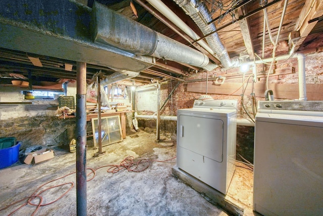 basement with washer and clothes dryer