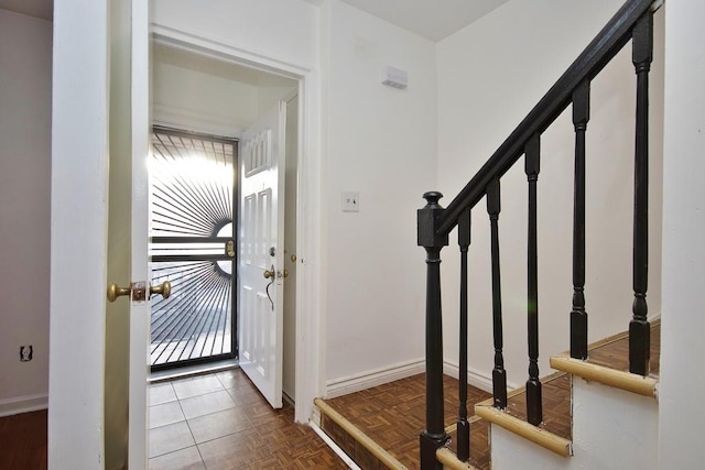 foyer with dark parquet floors