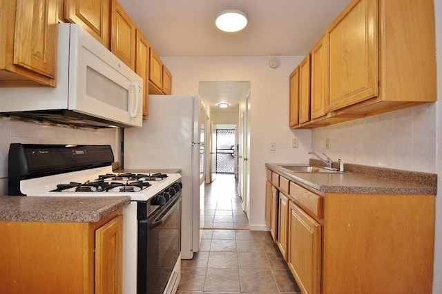 kitchen with backsplash, light tile patterned flooring, white appliances, and sink