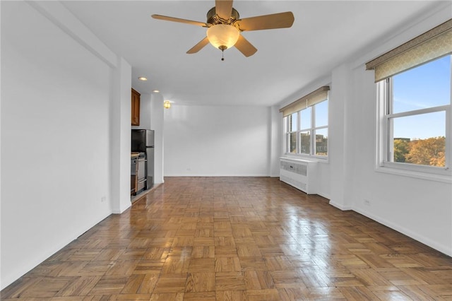 3935 Blackstone Ave Unit 5K, Bronx, NY 10471 - unfurnished living room with a ceiling fan, radiator, baseboards, and recessed lighting