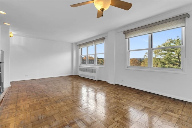 3935 Blackstone Ave Unit 5K, Bronx, NY 10471 - empty room with radiator, a ceiling fan, baseboards, and recessed lighting