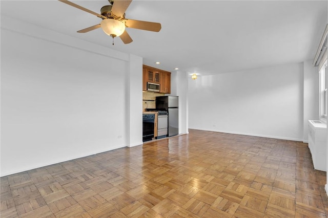 3935 Blackstone Ave Unit 5K, Bronx, NY 10471 - unfurnished living room with ceiling fan, baseboards, and recessed lighting