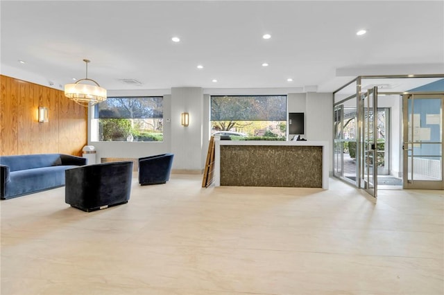 3935 Blackstone Ave Unit 5K, Bronx, NY 10471 - reception featuring wood walls, recessed lighting, and a chandelier