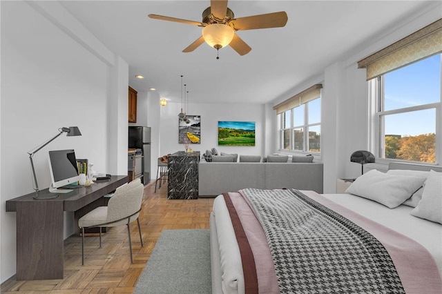 3935 Blackstone Ave Unit 5K, Bronx, NY 10471 - bedroom featuring recessed lighting, a desk, freestanding refrigerator, and ceiling fan