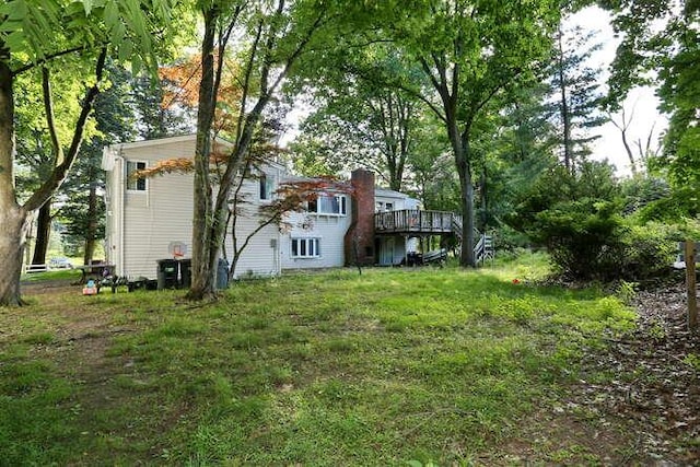 view of yard featuring a wooden deck