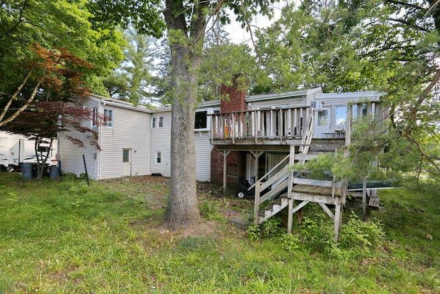 rear view of property with a wooden deck