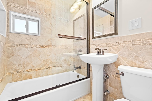 bathroom featuring toilet, tub / shower combination, tile walls, and tile patterned floors