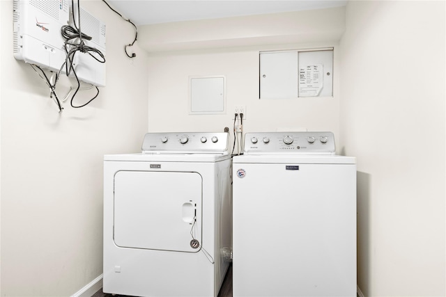 laundry area featuring washing machine and dryer, laundry area, and baseboards