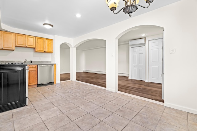 kitchen featuring a chandelier, stainless steel dishwasher, light tile patterned flooring, and a baseboard radiator