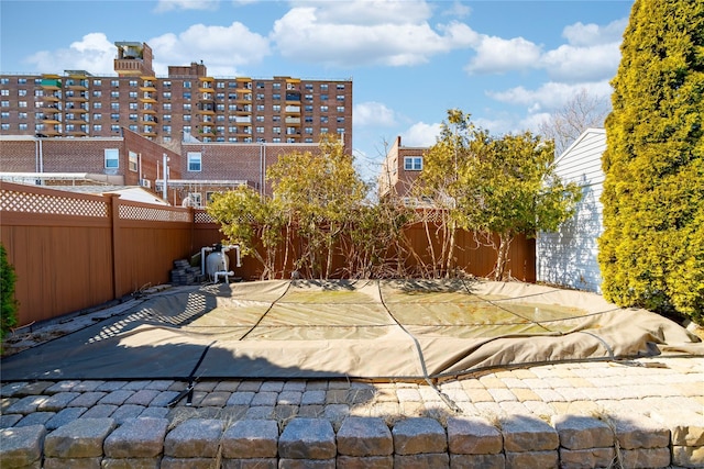 view of patio featuring fence