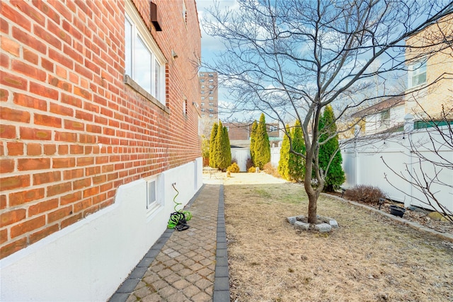 view of yard featuring fence