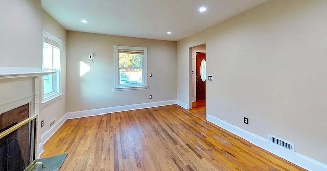 unfurnished living room with light wood-type flooring