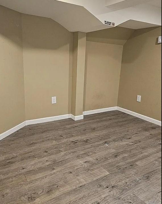 basement featuring dark wood-type flooring