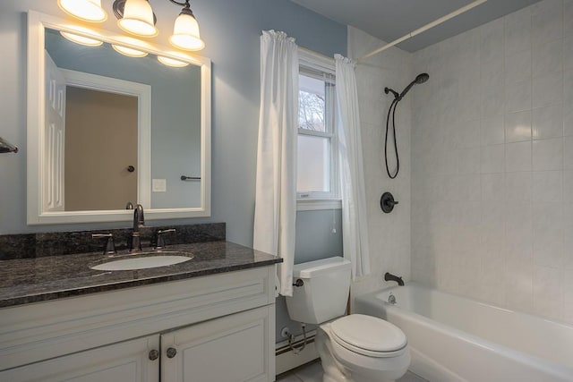 full bathroom featuring vanity, toilet, baseboard heating, and tiled shower / bath