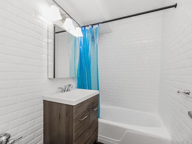 bathroom with shower / bath combo and vanity