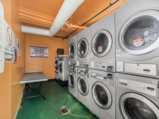 laundry room featuring washing machine and clothes dryer and stacked washer and clothes dryer