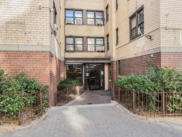 doorway to property featuring cooling unit