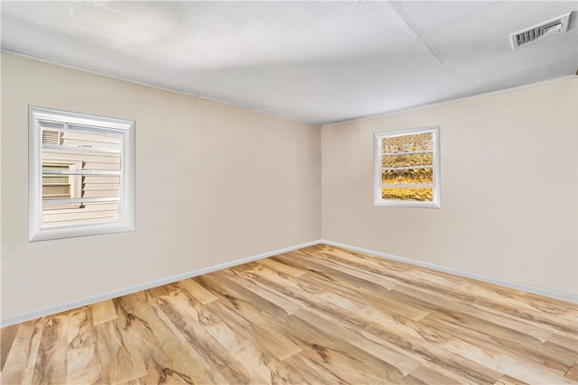 empty room featuring hardwood / wood-style flooring