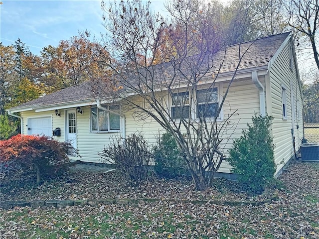 ranch-style home featuring central AC unit