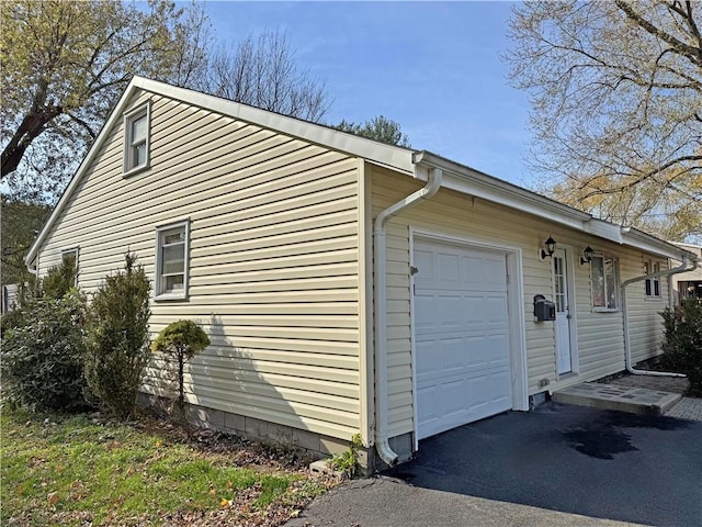 view of property exterior featuring a garage