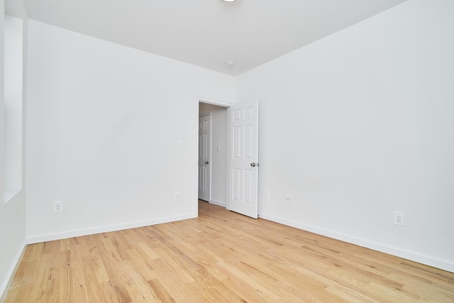 unfurnished room with light hardwood / wood-style floors