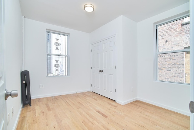 empty room with light wood-type flooring