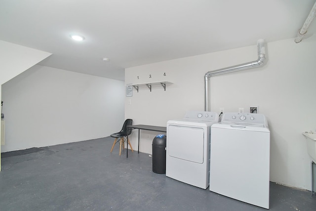 clothes washing area with washer and dryer