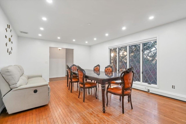 dining area with light hardwood / wood-style flooring