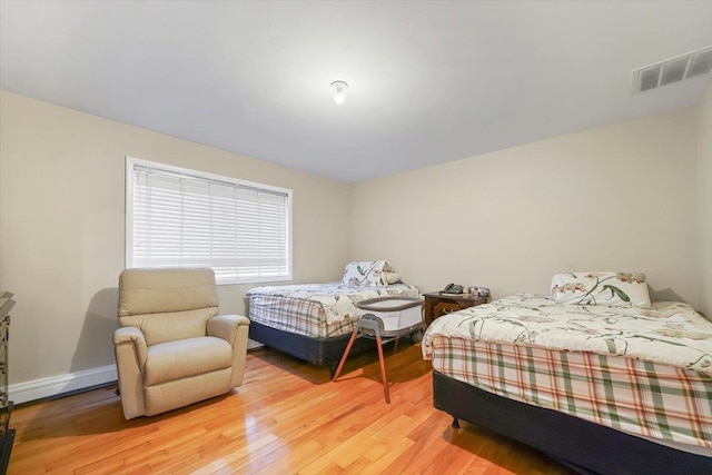 bedroom with light hardwood / wood-style flooring