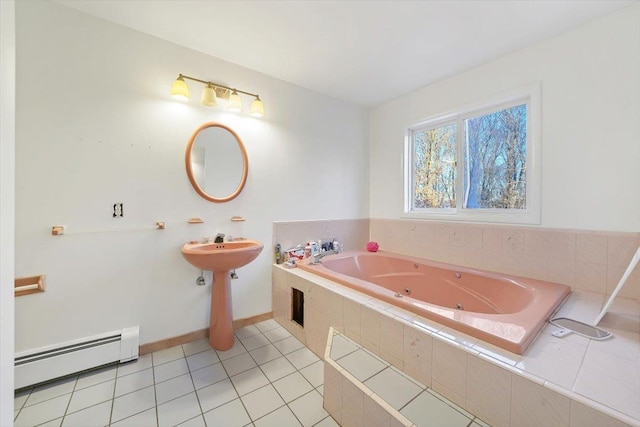 bathroom featuring tile patterned flooring, tiled tub, and a baseboard radiator