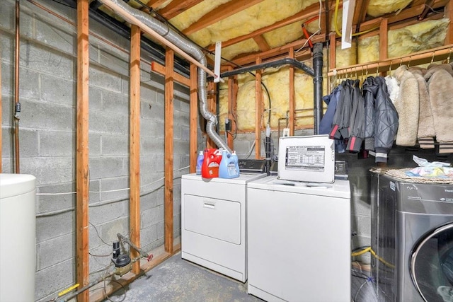 laundry room featuring washing machine and clothes dryer