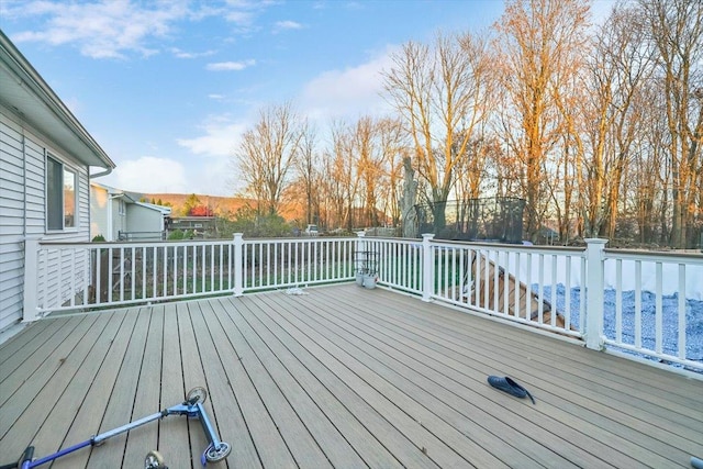 wooden deck with a trampoline