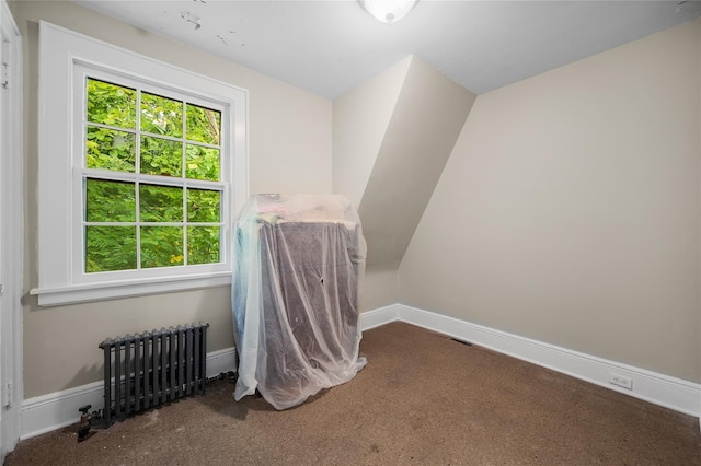 interior space with baseboards and radiator heating unit