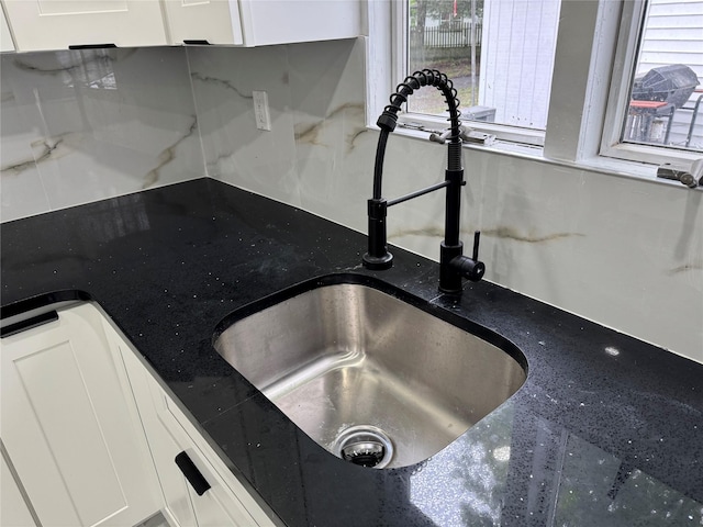 3 Brookside Trl, Monroe, NY 10950 - kitchen view of white cabinetry, a sink, and tasteful backsplash