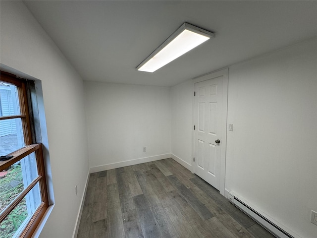 3 Brookside Trl, Monroe, NY 10950 - spare room featuring baseboard heating, dark wood-type flooring, plenty of natural light, and baseboards