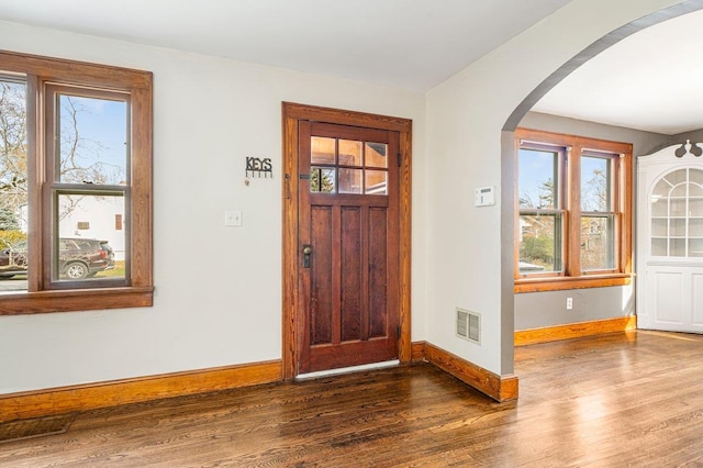 foyer entrance with dark hardwood / wood-style flooring